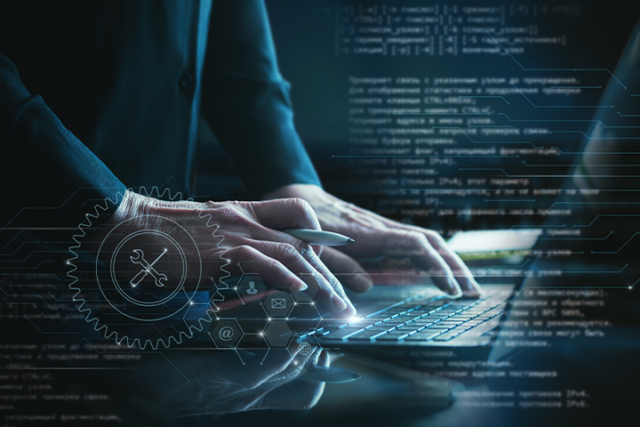 Team building custom software solutions on computers in an office